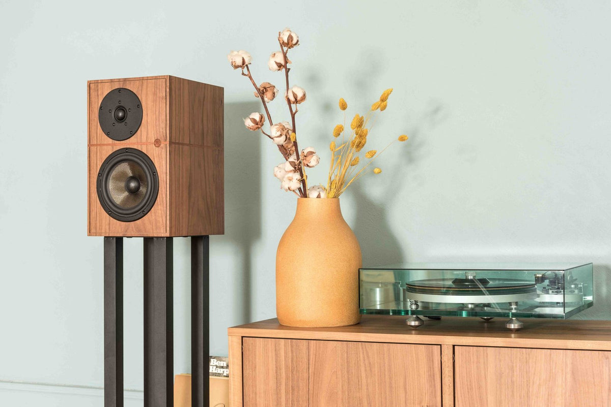 Revival Audio ATALANTE 3 in Walnut beside a turntable, official lifestyle photograph